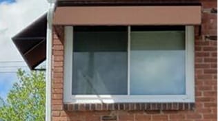 brown fabric window awning