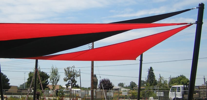 Transform your backyard into an oasis of relaxation and comfort with the installation of beautiful green shade sails.